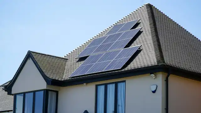 Solar panels on the tiled roof of a house